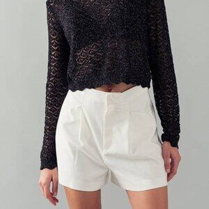 White pleated shorts
